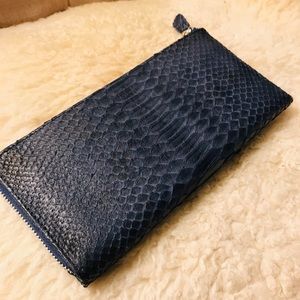 Navy blue animal print wallet with suede lining.